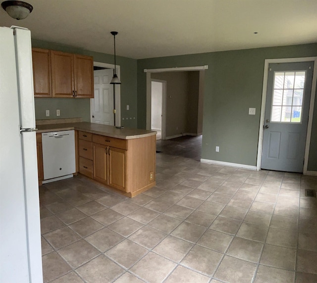 1106 Marsac St, Bay City, MI 48708 - kitchen with white appliances, light tile patterned floors, a peninsula, decorative light fixtures, and baseboards