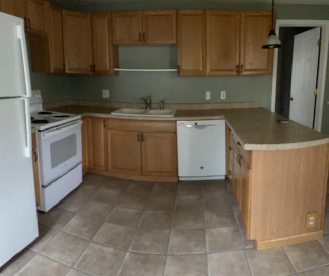 1106 Marsac St, Bay City, MI 48708 - kitchen featuring white appliances, a sink, a peninsula, light countertops, and pendant lighting