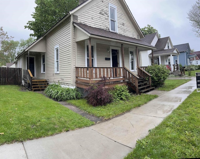 1106 Marsac St, Bay City, MI 48708 - view of front of property featuring a porch and a front yard