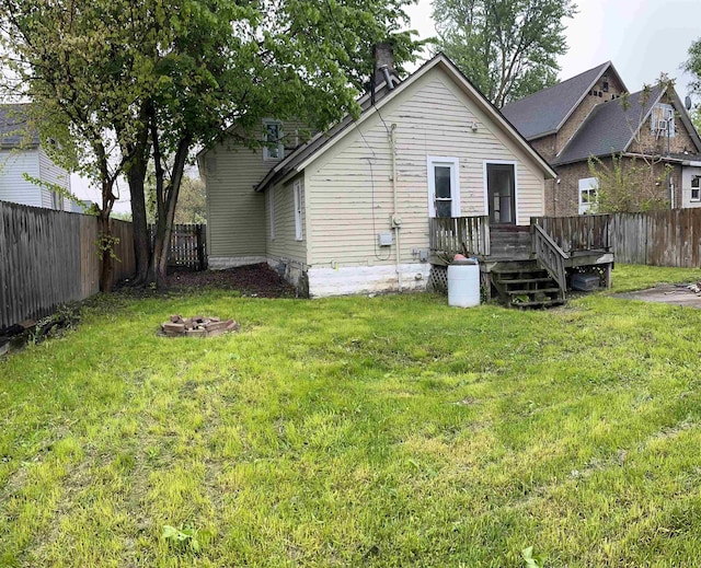 1106 Marsac St, Bay City, MI 48708 - rear view of property featuring a deck and a fire pit