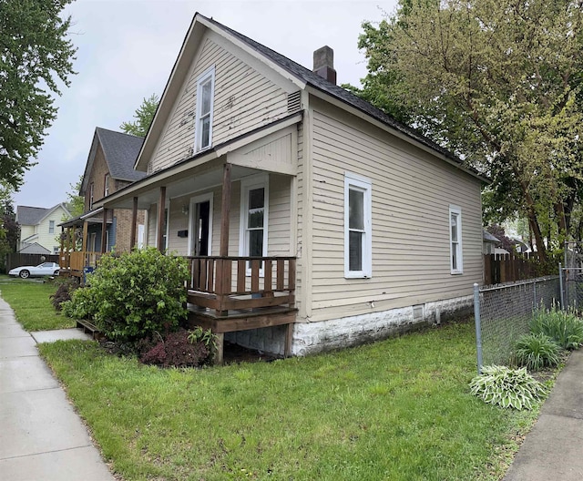 1106 Marsac St, Bay City, MI 48708 - view of home's exterior featuring covered porch and a chimney