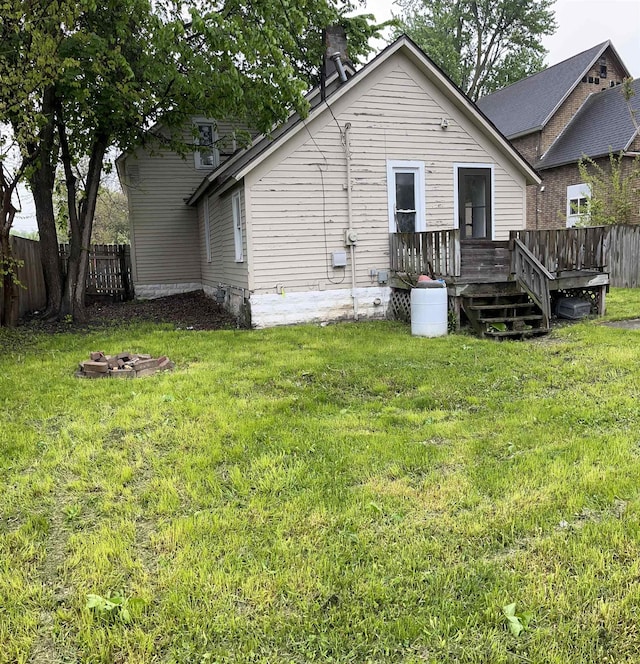 1106 Marsac St, Bay City, MI 48708 - rear view of property featuring a deck and a chimney