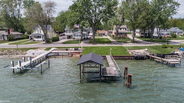 6138 River Rd, East China, MI 48054 - dock featuring a water view, a residential view, and a lawn