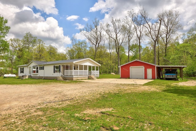 3909 Higgins Rd, Vassar, MI 48768 - view of front facade with driveway, a porch, and a front yard