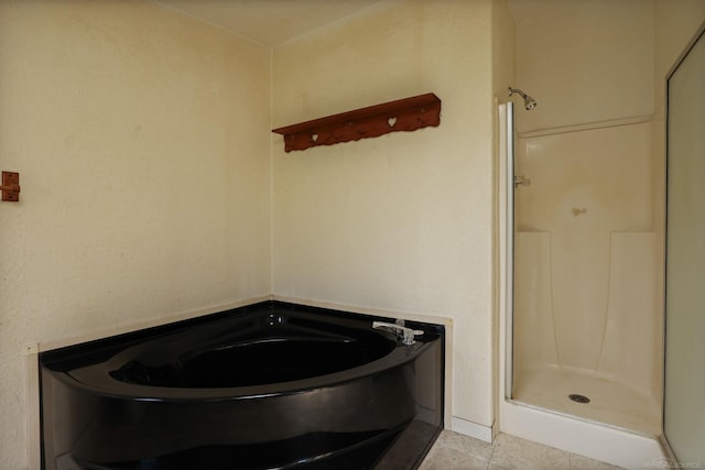 3909 Higgins Rd, Vassar, MI 48768 - full bathroom with a stall shower, a bath, and tile patterned floors