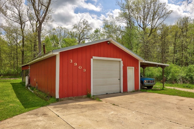 3909 Higgins Rd, Vassar, MI 48768 - garage featuring driveway and a detached garage