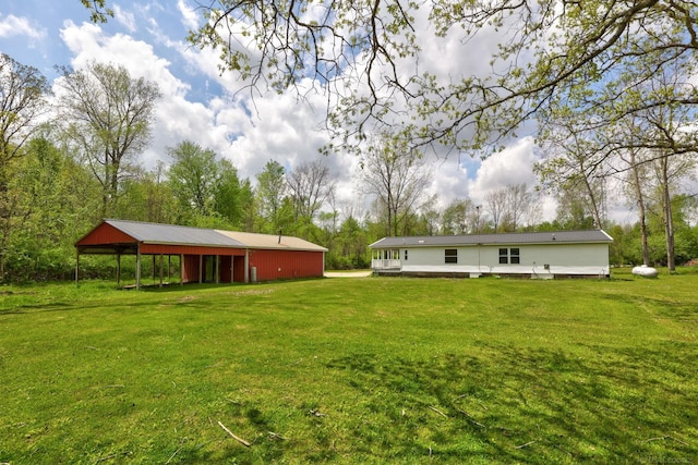 3909 Higgins Rd, Vassar, MI 48768 - view of grassy yard featuring an outbuilding