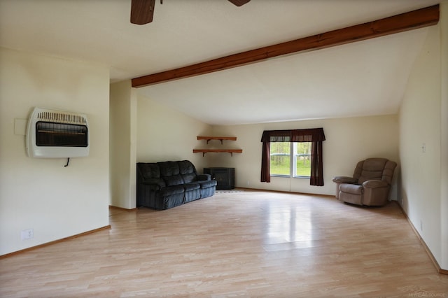 3909 Higgins Rd, Vassar, MI 48768 - unfurnished room with heating unit, ceiling fan, light wood-style flooring, a fireplace, and baseboards