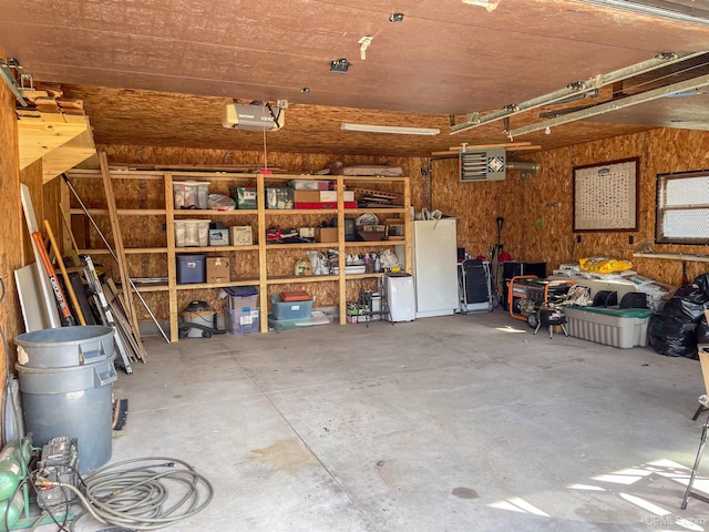 16477 Cc.25 Ln, Wetmore, MI 49895 - garage with a garage door opener and a heating unit
