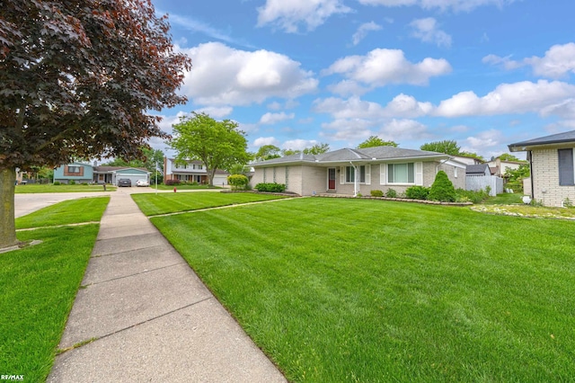 37601 Dartmouth Dr, Sterling Heights, MI 48310 - view of front of property with a front yard, a detached carport, driveway, and brick siding