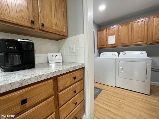 7314 Aspen Rd, Lexington, MI 48450 - washroom featuring washer and dryer and light wood-type flooring