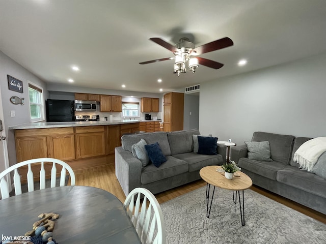 7314 Aspen Rd, Lexington, MI 48450 - living room with recessed lighting, light wood-style flooring, and a ceiling fan