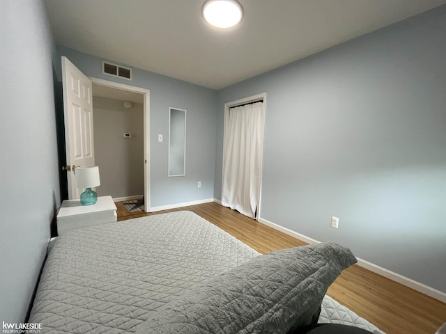 7314 Aspen Rd, Lexington, MI 48450 - bedroom featuring baseboards and wood finished floors
