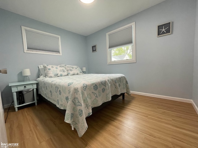 7314 Aspen Rd, Lexington, MI 48450 - bedroom featuring baseboards and wood finished floors