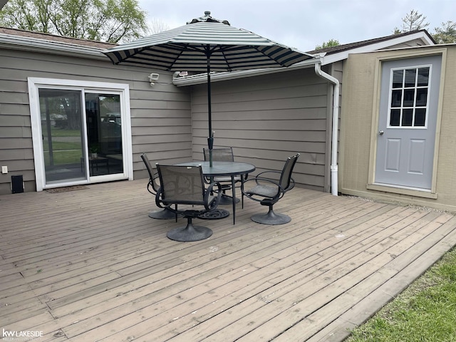 7314 Aspen Rd, Lexington, MI 48450 - deck featuring outdoor dining area