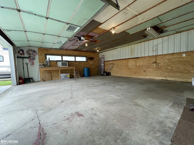 7314 Aspen Rd, Lexington, MI 48450 - garage featuring a garage door opener