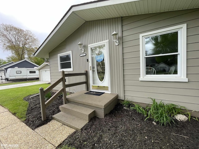 7314 Aspen Rd, Lexington, MI 48450 - view of exterior entry featuring a garage