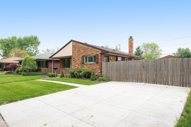 21036 Suffolk St, Clinton Township, MI 48035 - view of front of property featuring brick siding and a chimney