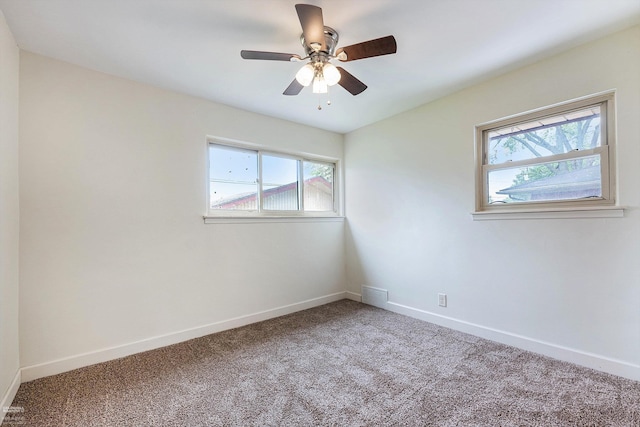 21036 Suffolk St, Clinton Township, MI 48035 - empty room featuring healthy amount of natural light, carpet flooring, and baseboards