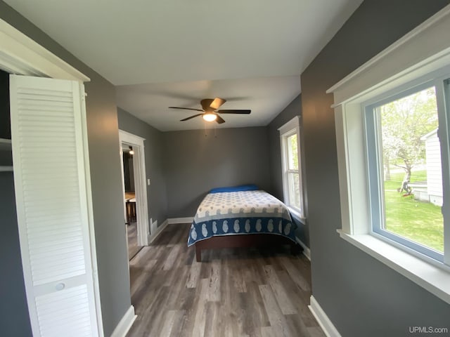 317 Lane Ave, Iron Mountain, MI 49802 - bedroom featuring baseboards, wood finished floors, and a ceiling fan