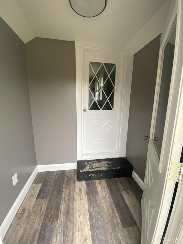 317 Lane Ave, Iron Mountain, MI 49802 - entryway with wood finished floors, vaulted ceiling, and baseboards
