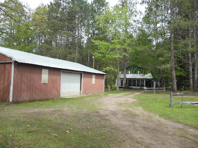 5871 Edith Schneider Rd, Harrison, MI 48625 - view of yard with an outdoor structure, driveway, and a garage