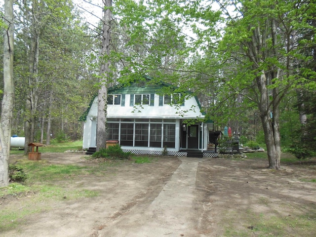 5871 Edith Schneider Rd, Harrison, MI 48625 - view of front of house with a sunroom