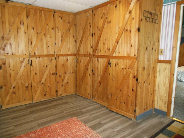 5871 Edith Schneider Rd, Harrison, MI 48625 - spare room featuring wood finished floors and wooden walls