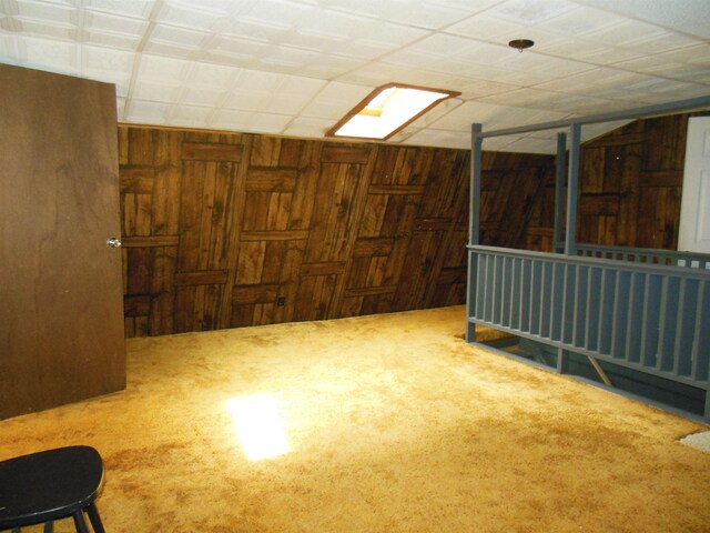 5871 Edith Schneider Rd, Harrison, MI 48625 - spare room with wooden walls and carpet flooring