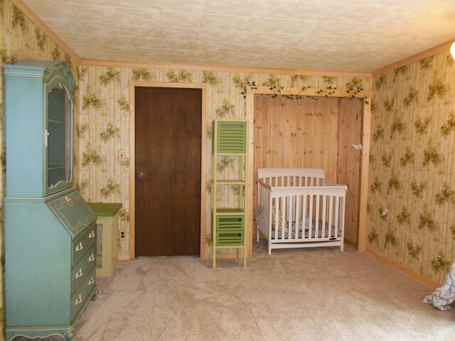 5871 Edith Schneider Rd, Harrison, MI 48625 - unfurnished bedroom with wallpapered walls, carpet flooring, and baseboards
