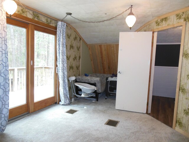 5871 Edith Schneider Rd, Harrison, MI 48625 - bonus room with carpet floors, lofted ceiling, and wooden walls