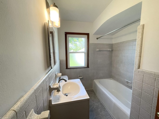 19993 Woodmont St, Harper Woods, MI 48225 - bathroom featuring tile walls, shower / bath combination, vanity, and wainscoting