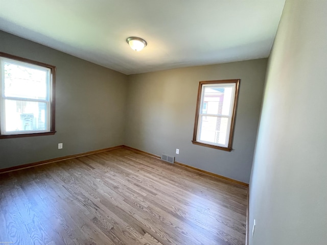 19993 Woodmont St, Harper Woods, MI 48225 - empty room with wood finished floors and baseboards