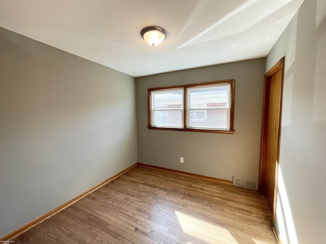19993 Woodmont St, Harper Woods, MI 48225 - empty room featuring light wood finished floors and baseboards