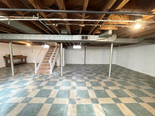 19993 Woodmont St, Harper Woods, MI 48225 - finished basement featuring stairway and tile patterned floors