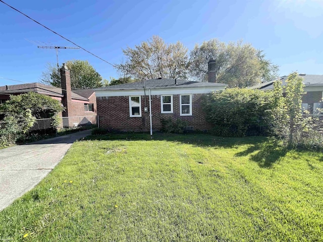 19993 Woodmont St, Harper Woods, MI 48225 - view of front of property with brick siding and a chimney