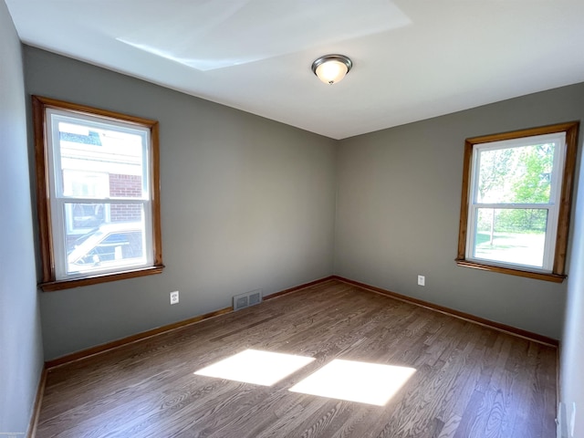 19993 Woodmont St, Harper Woods, MI 48225 - empty room with wood finished floors and baseboards