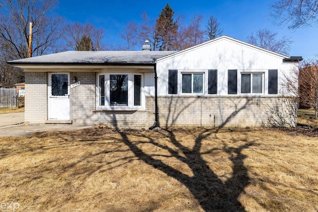 3168 Herbell Dr, Waterford, MI 48328 - view of side of property featuring brick siding, a lawn, and a chimney