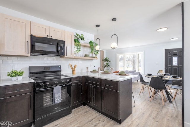 3168 Herbell Dr, Waterford, MI 48328 - kitchen featuring black appliances, light countertops, light wood finished floors, backsplash, and recessed lighting