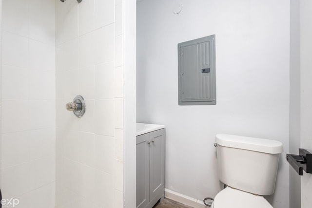 3168 Herbell Dr, Waterford, MI 48328 - bathroom with electric panel, toilet, a tile shower, and vanity