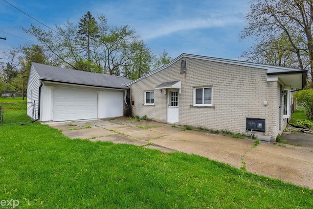 3168 Herbell Dr, Waterford, MI 48328 - back of property with brick siding and concrete driveway