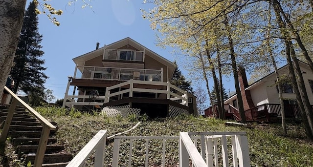 7741 White Birch St, Farwell, MI 48622 - rear view of property featuring stairway and a wooden deck