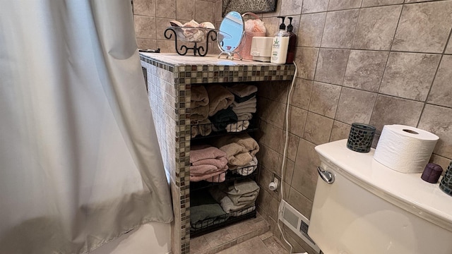 7741 White Birch St, Farwell, MI 48622 - bathroom view of tile walls and shower / bath combo with shower curtain
