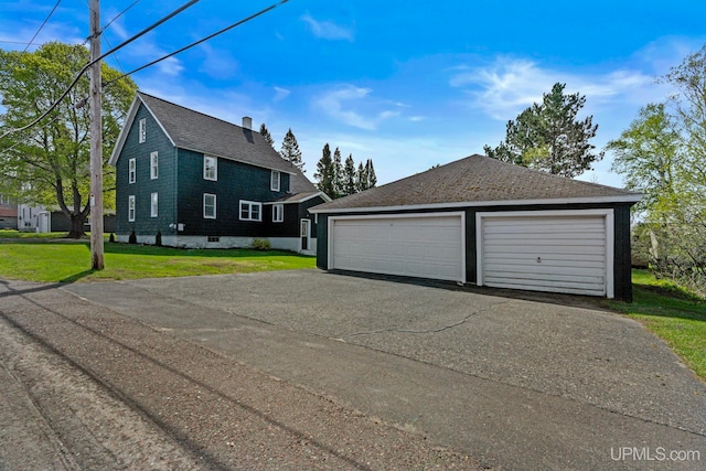 336 Fulton St, Mohawk, MI 49950 - view of front of property with a garage, a front lawn, and a shingled roof