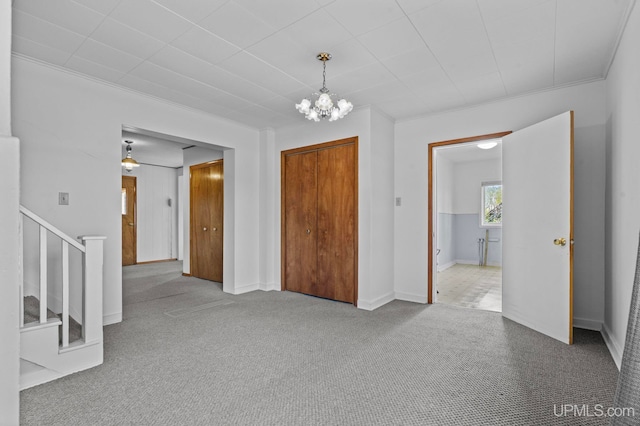 336 Fulton St, Mohawk, MI 49950 - entrance foyer with stairs, carpet, a chandelier, and baseboards