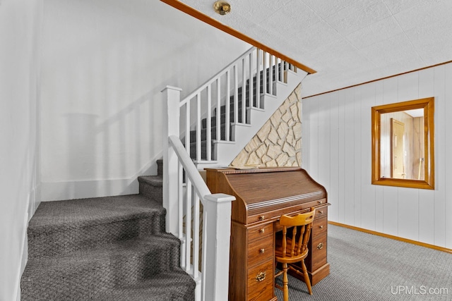 336 Fulton St, Mohawk, MI 49950 - stairway featuring carpet floors, baseboards, ornamental molding, and wood walls