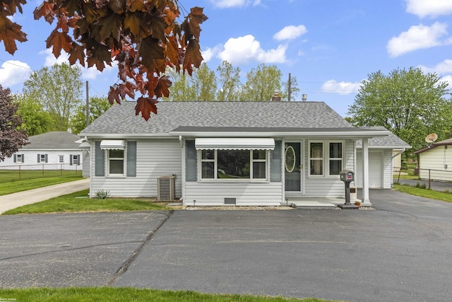 3710 N River Rd, Fort Gratiot, MI 48059 - view of front of home featuring roof with shingles, a chimney, and asphalt driveway