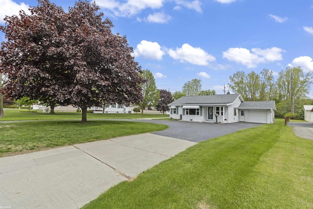 3710 N River Rd, Fort Gratiot, MI 48059 - view of front of house with driveway, a front yard, and an attached garage