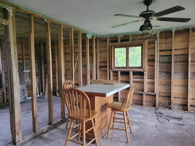 5523 Red Oak Rd, Beaverton, MI 48612 - dining space with a bar and a ceiling fan