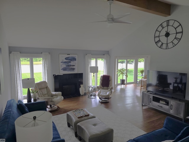 43173 Winterfield Dr, Sterling Heights, MI 48314 - living area with high vaulted ceiling, ceiling fan, wood finished floors, plenty of natural light, and beam ceiling
